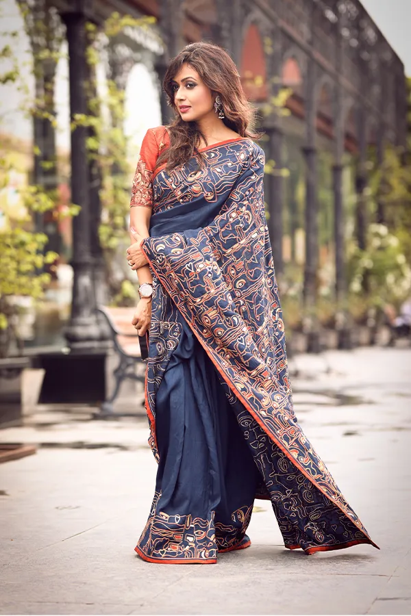 SAMMUKHA || EXQUISITE BLUE ARTISANAL FACES MOTIF SAREE Hover